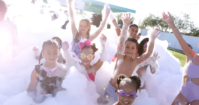 Backyard foam party with a rented cannon