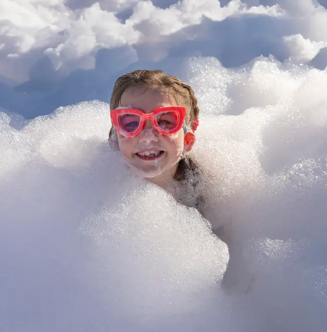 Kids in foam at a backyard party